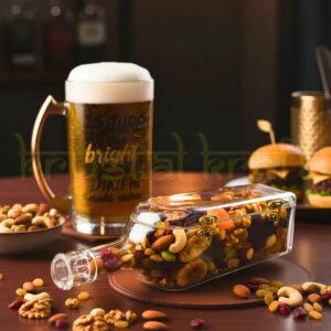 Upcycled Johnnie Walker glass bottle canister on modern kitchen countertop storing cashews almonds dry fruits next to coffee maker elegant home decor storage solution handcrafted by Krystal Kraft artist