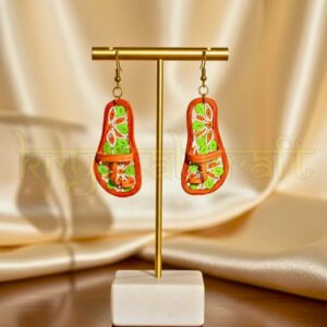 “Front view of Artistic Vibrant Kolhapuri paper quilling earrings by Krystal Kraft in orange, green, and white, handmade by artist Farisa Merchant.”