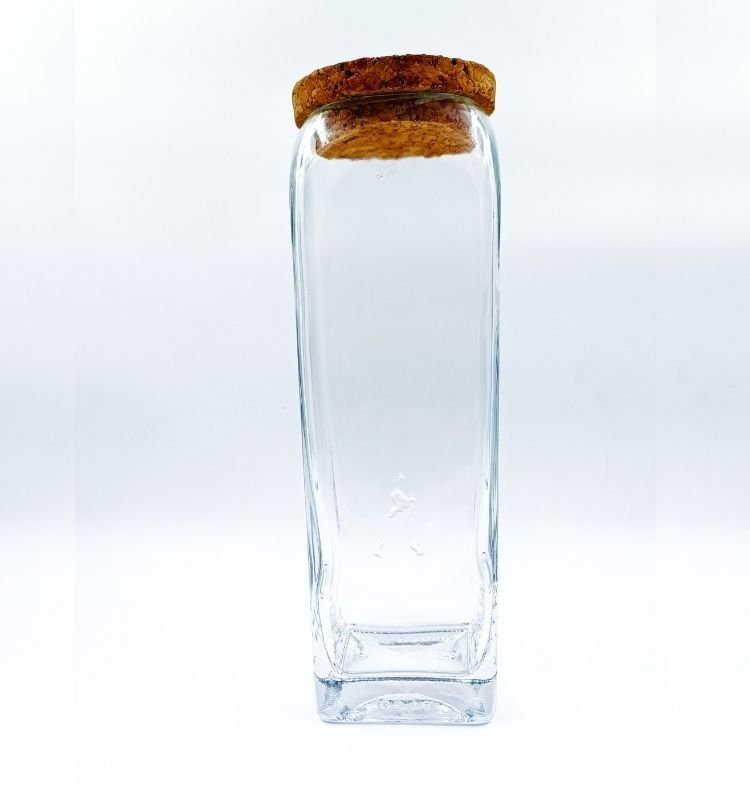 Eco-chic handcrafted Gold Label square glass jar by Krystal Kraft, made from recycled glass bottles with a cork lid for freshness and decorative elegance.