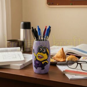 Hand-painted Laughing Minion art on a recycled Amul glass bottle by artist Farisa Merchant — featuring a cheerful yellow Minion design on a dark purple base with a glossy Liquitex finish.