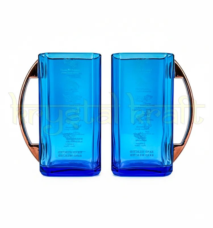 Beautiful pair of handmade mugs crafted from recycled Bombay Sapphire glass bottles, highlighting sustainable upcycled craftsmanship and eco-friendly artistry by Krystal Kraft.