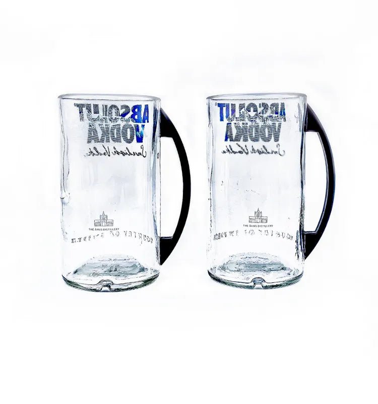 Artistic upcycled Absolut bottle mugs showcasing sustainable craftsmanship