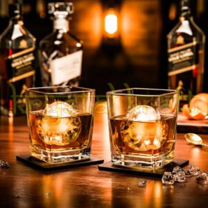 Upcycled Johnnie Walker Gold Label glasses handcrafted from recycled bottles for eco-friendly barware.