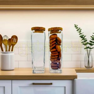 Set of two handcrafted Gold Label square glass jars with smooth finish and airtight wooden cork lids, designed by Raees Ahmed Merchant for sustainable kitchen storage.