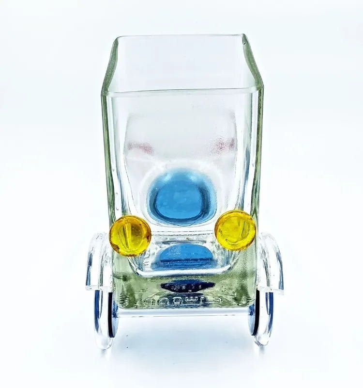 Artistic Merchant’s Marvel Truck made from an upcycled whisky glass bottle – truck-shaped sustainable serving bowl and candleholder for modern eco-conscious homes.