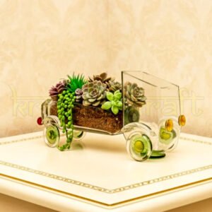 Handcrafted Nostalgic Gold Rush Truck Planter by Krystal Kraft, designed by Raees Ahmed Merchant from an upcycled Gold Label whiskey glass bottle – vintage-inspired glass art piece perfect as a planter, candle holder, or centerpiece.