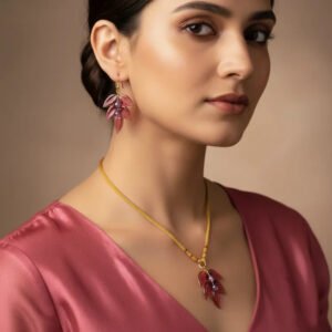 Handcrafted peach leaf glass earrings made by Indian artisan Shazia Merchant.