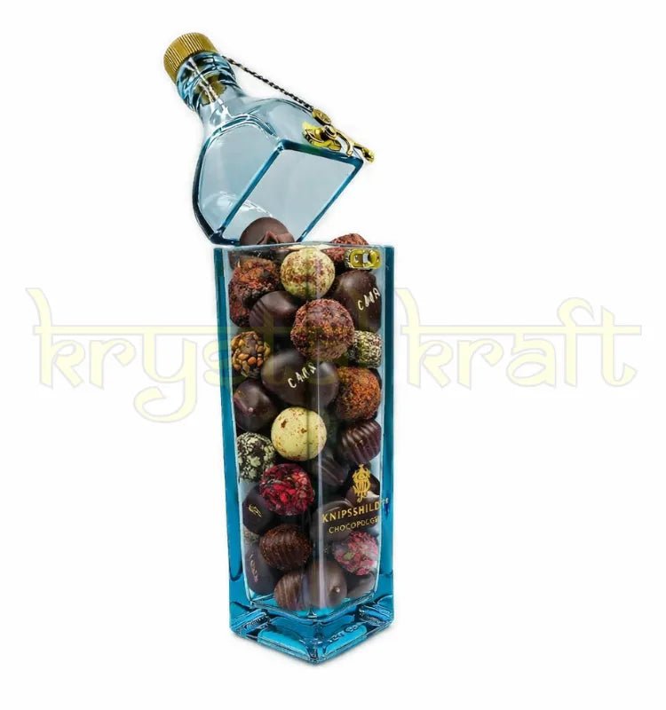 Artistic recycled glass bottle canister transformed into a candy storage jar with cork lid, handmade eco-friendly decor.