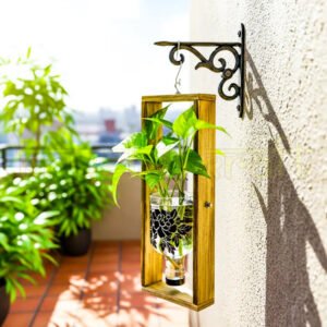 A handcrafted hanging wall planter made from an upcycled Greater Than Gin bottle with elegant floral print, mounted on a wooden frame — perfect for indoor or balcony greenery.