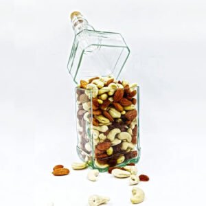 Upcycled Jack Daniel's glass bottle canister filled with almonds, cashews, and raisins. Unique dry fruit storage and rustic home decor.