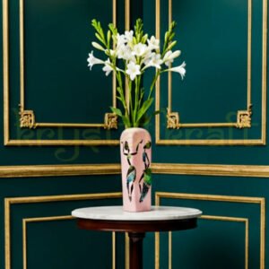 Beautifully hand-painted recycled glass bottle vase by Farisa Merchant featuring a Dancing African Lady in vibrant acrylic hues on a soft pink background — perfect eco-friendly décor accent for modern homes.